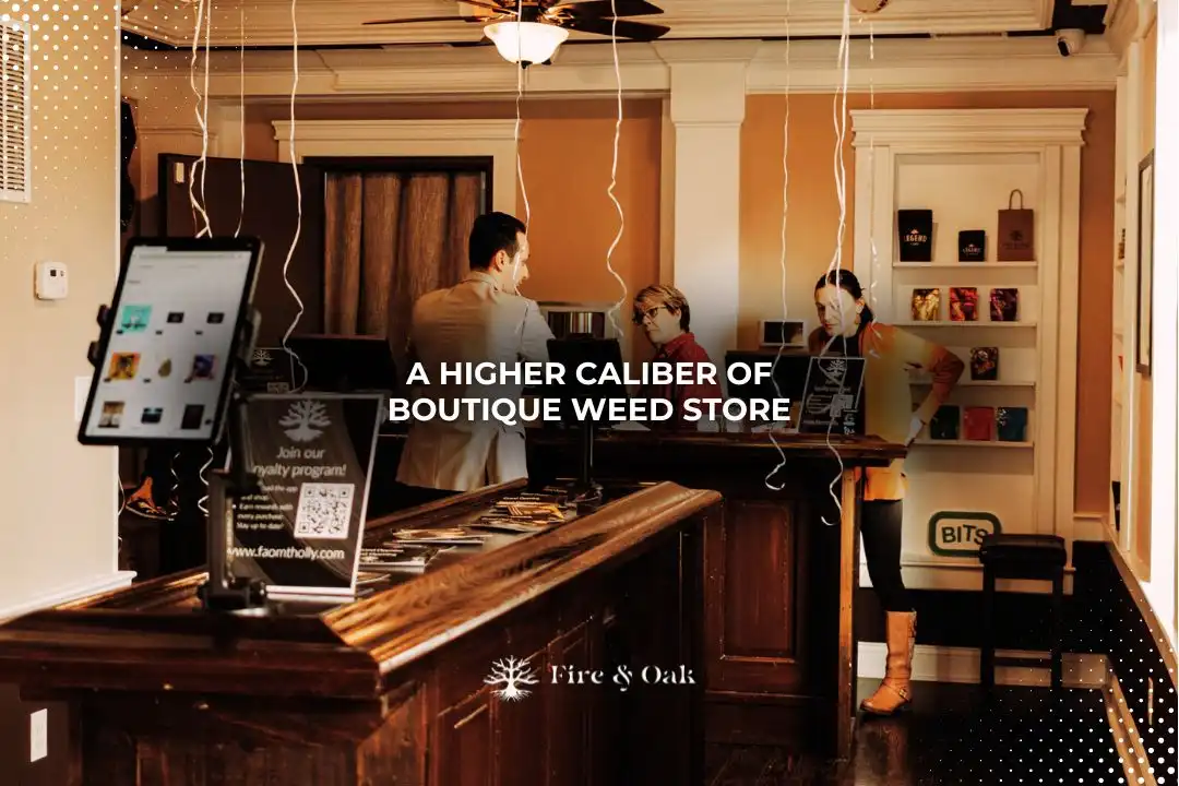 Interior of Fire & Oak, a boutique weed store, featuring a wooden counter, digital displays, and customers engaging with staff. The store emphasizes a high-quality shopping experience for cannabis products.